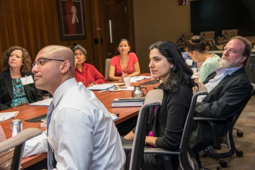 faculty and staff seated around a conference table